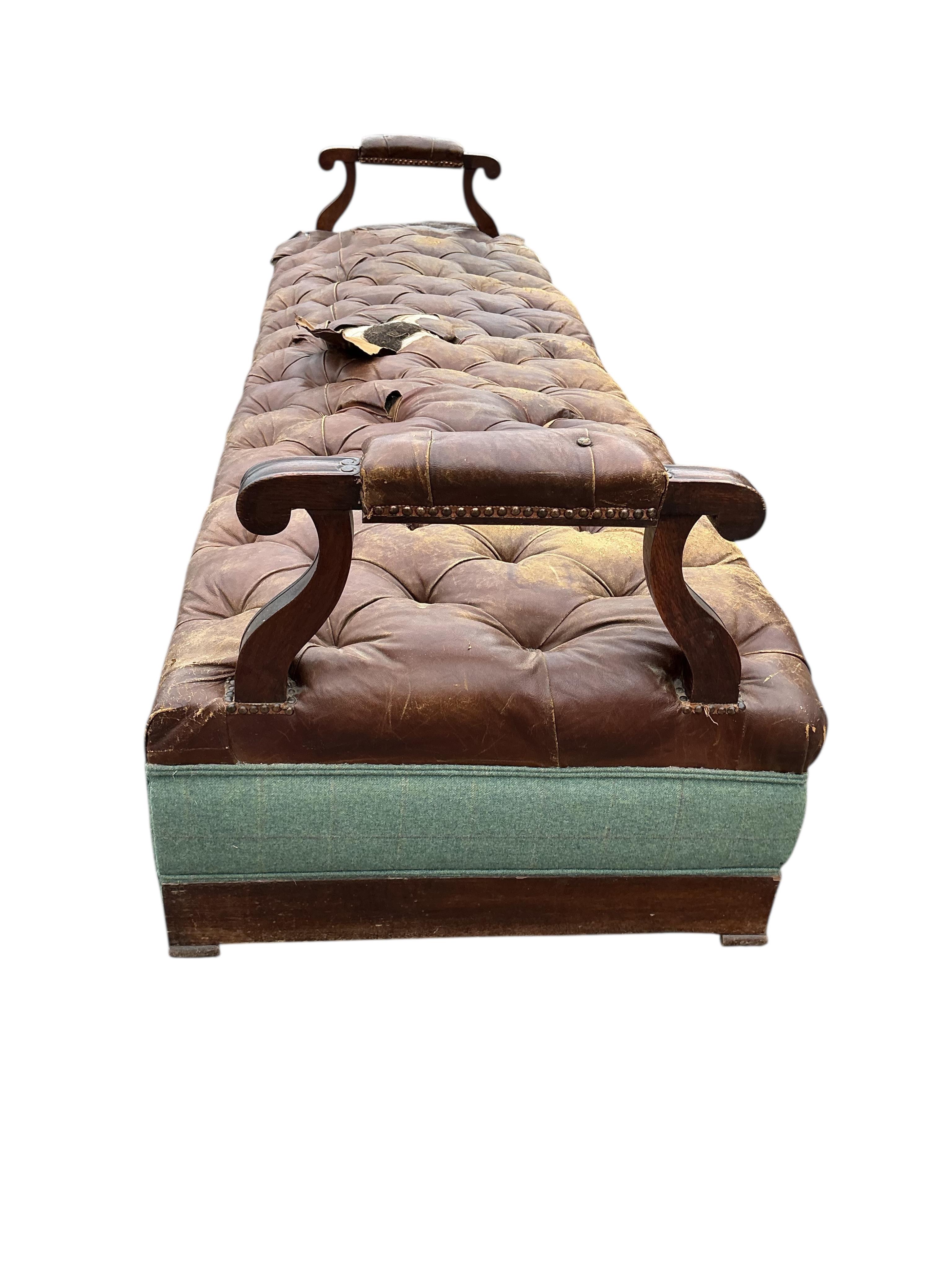 A Victorian oak and buttoned brown leather bench seat, width 266cm, depth 84cm, height 72cm